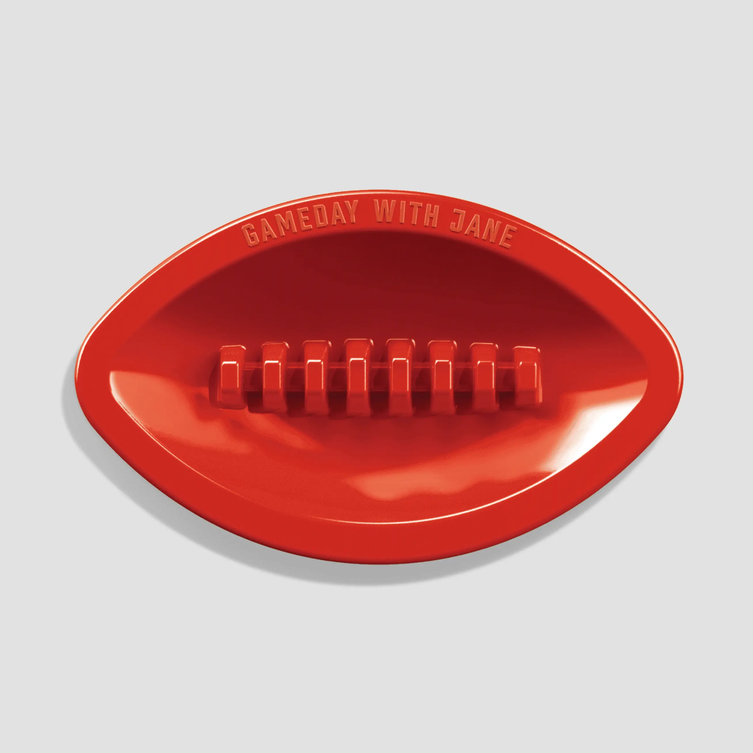 Gameday With Jane Football Ashtray by Jane West, a durable melamine ashtray designed for game day rituals, featuring a stylish football shape that adds a fun and functional touch to your celebrations, perfect for everyday smokers who enjoy a good game.